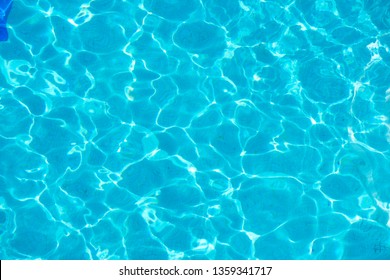 blue water in swimming pool - Shutterstock ID 1359341717