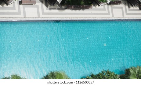 Blue Water Swimming Pool Olympic Long Size In Summer Holiday And Sunny Reflect On Serface For Relax And Sport Top View.