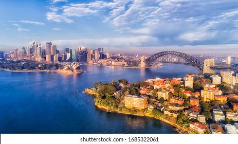 BLue Water Of Sydney Harbour With Major City Landmarks On Waterfront Of CBD And North Shore In Aerial View.