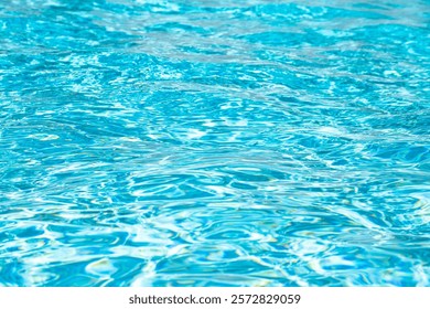 Blue water texture background. Background of pool water surface. Blue aqua water surface. Blue pool water texture background. Surface of swimming pool.