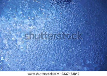 Blue water texture. Bubbles bubbling water.