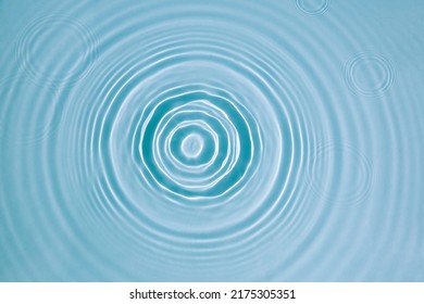 Blue water texture, surface with rings, ripples. Spa concept background