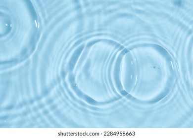 Blue water texture, blue water surface with rings and ripples. Spa concept background. Flat lay