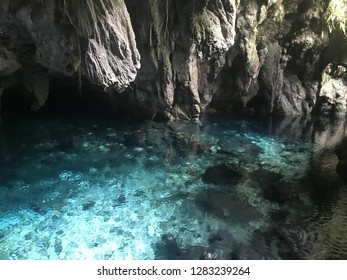 Blue watercolor natural pool inside Hawang Cave in Kei Island, Indonesia