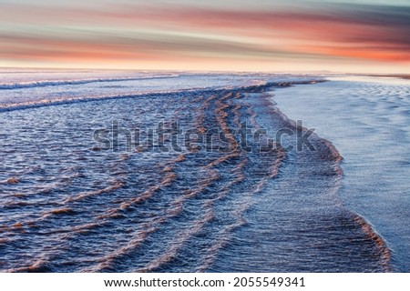Blue wave on the beach. Dramatic natural background.