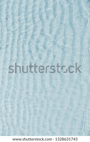 Blue wave pattern on the sand in the sea.
