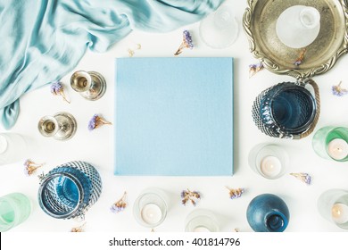 Blue Wedding Or Family Photo Album, Vintage Old-fashioned Golden Tray, Candlesticks, Flowers, Silk Dress Isolated On White Background. Flat Lay, Overhead View