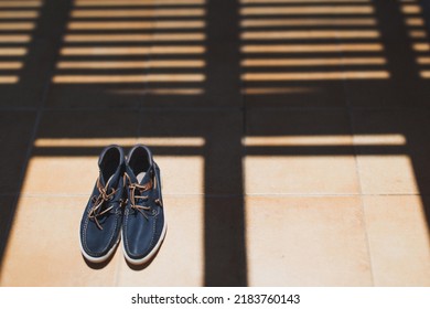 Blue Wedding Shoes On A Striped Floor.