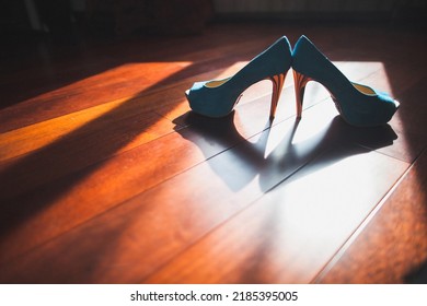 Blue Wedding Shoes Stand On A Wooden Floor.