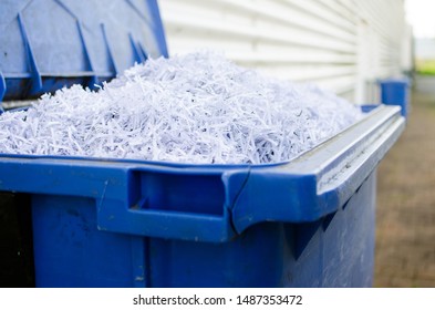 Blue Whelie Bin Full Of Shredded Paper