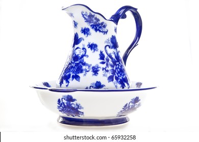 Blue and white antique pottery pitcher and basin isolated on white. - Powered by Shutterstock