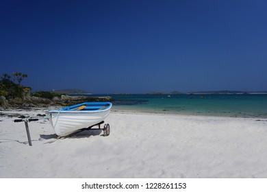 Blue And White Boat On Sandy Beach Tresco, Scilly Isles, UK