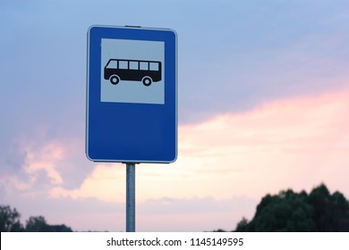 Blue And White Bus Stop Sign In Europe With Sky Background