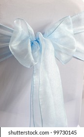 Blue And White Chair Cover At A Wedding Reception