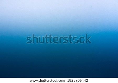 Blue and white gradient concrete wall background