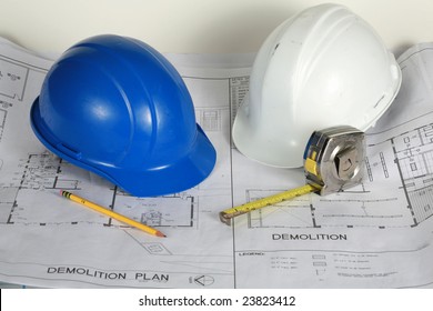 Blue And White Hard Hats On Blue Prints