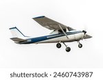 Blue and white light aircraft in flight. Propellor driven high wing aircraft used for recreation and flight training. Classic general aviation airplane isolated
