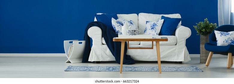 Blue and white living room with rustic accents