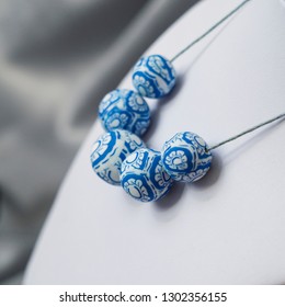 Blue And White Polymer Clay Beads On A Necklace