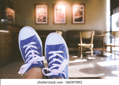 Blue And White Sneakers. First Person Perspective With Instagram Style Filter.