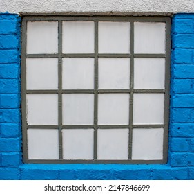 Blue And White Wall With A Grey Window Fram