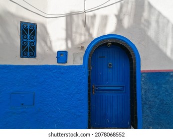 Blue And White Walls Of The Rabat Medina House And A Traditional Blue Door