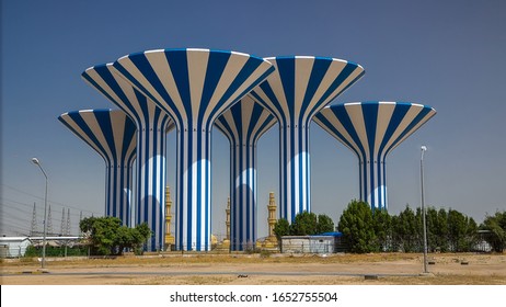 Blue and white water towers in Kuwait view , Middle East. Blue sky and mosque on background