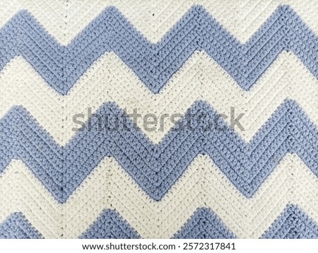 Blue and White Zig-Zag Pattern Crochet Tablecloth on Background