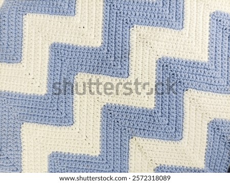 Blue and White Zig-Zag Pattern Crochet Tablecloth on Background