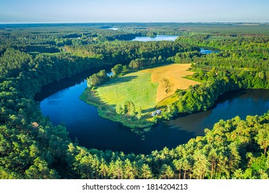 Blue Winding River Between Green Forests At Sunrise, Europe