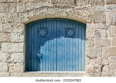 
Blue Wooden Barn Door At The Waterfront
