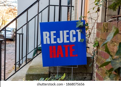 A blue yard sign that says Reject Hate is placed on the front yard of an old building ahead of US elections to ease political tension and social unrest which has peaked in the recent months. - Shutterstock ID 1868075656