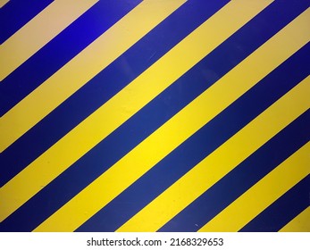 Blue yellow background with diagonal pattern to the right
