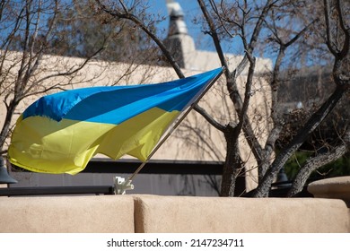 Blue And Yellow Flag Of Ukraine Displayed And Blowing In The Wind From Adobe Home In Santa Fe New Mexico Sign Of Support For Ukrainians In Their Struggle Of War Horizontal Format Room For Type