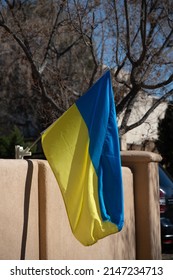 Blue And Yellow Flag Of Ukraine Displayed And Blowing In The Wind From Home In Santa Fe New Mexico Sign Of Support For Ukrainians  In Their Struggle Of War Vertical Format Room For Type 