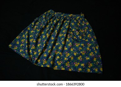 Blue And Yellow Floral Print Skirt On Black Background