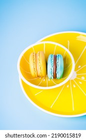 Blue And Yellow Macaron On A Yellow Plate