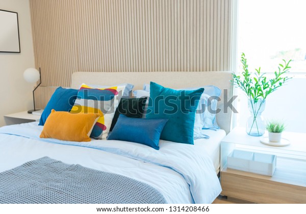 Blue Yellow Pillows On Bed Bed Stock Photo Edit Now 1314208466