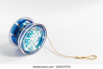 A blue yo-yo with twine isolated on a white background