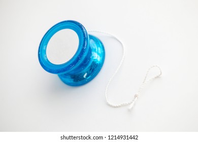 Blue Yo-yo Yo Yo Toy With A Knotted String On A White Background