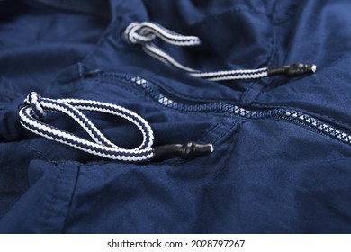 Blue Zipper On A Blue Windbreaker Jacket. 