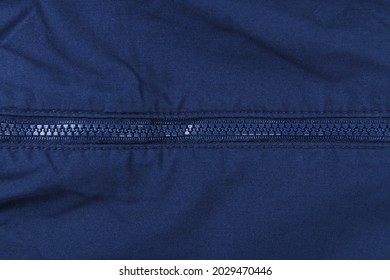 Blue Zipper On A Blue Windbreaker Jacket. 