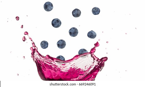 Blueberries Falling Into A Splashing Purple Juice