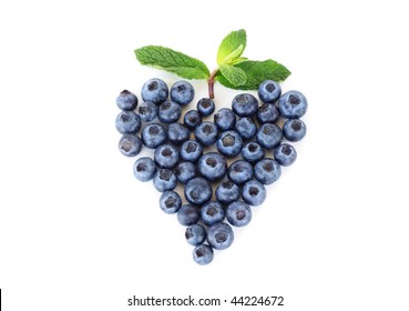 Blueberries In A Heart Shape With Mint Leaf