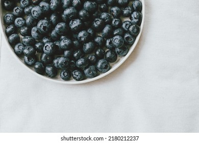 Blueberries In Modern Ceramic Plate Flat Lay. Summertime In Countryside. Healthy Food Aesthetics. Summer Berries On Soft Linen Background, Moody Banner