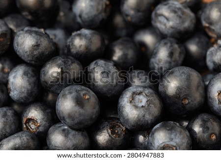 Blueberries none, in close-up view of blueberries, with blueberries, with fruit texture, from a close-up perspective perspective, with black, gray accents, and fresh and natural mood.