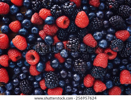 blueberries, raspberries and black berries shot top down