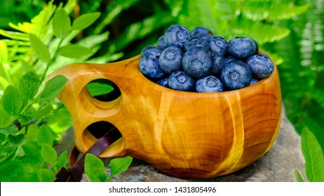 Blueberry Antioxidants Containing Super Food From Lapland. Antioxidant Berries In A Traditional Kuksa Wood Cup.