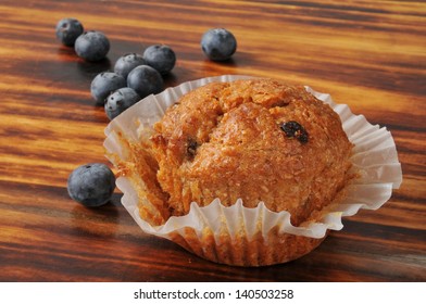 A Blueberry Bran Muffin On A Cutting Board