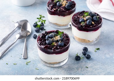 Blueberry cheesecake in a jar with graham cracker base, no bake dessert - Powered by Shutterstock